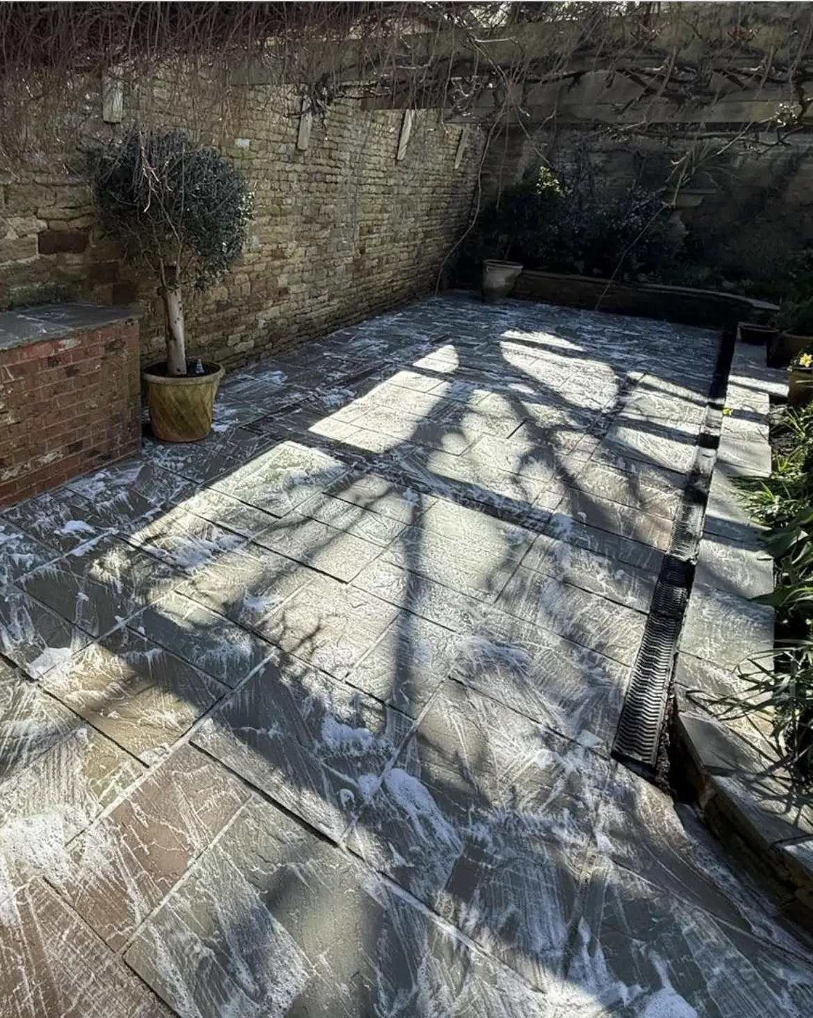 Patio cleaning by Geyserclean in Milton Keynes, work in progress